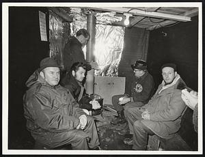 Inside of G.E. strike hut. Front left: Paul Ayers Danvers. Bob Comeau Saugus. Al Holties Lynn. Martin Green Lynn