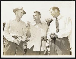 Explains How To Do It. Eddie Miller (center), Boston Braves Shortstop, explains to Johnny Cooney (left), Boston Braves outfielder and Jack Russell (right), unattached Big League pitcher, formerly with the Washington Senators, how he is going to “knock a home run,” in the opening round of the 7th annual professional baseball players golf tournament at the Miami, Fla., country club Feb. 11.