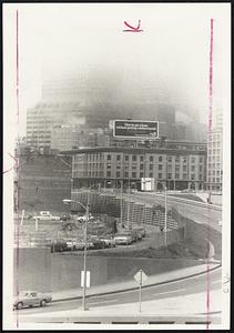 Fog That Moved into Boston swiftly and suddenly blots out Boston skyline as seen from near Kneeland street.