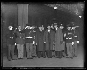 A group of unidentified soldiers salute