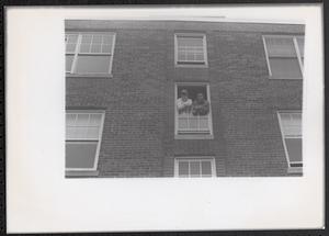 Two young men posing in a window, Newtowne Court