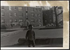 Girl standing in Newtowne Court