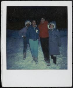 Group of four in winter clothing