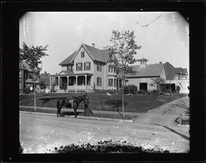 Girl with a horse in front of 175 Lincoln Street