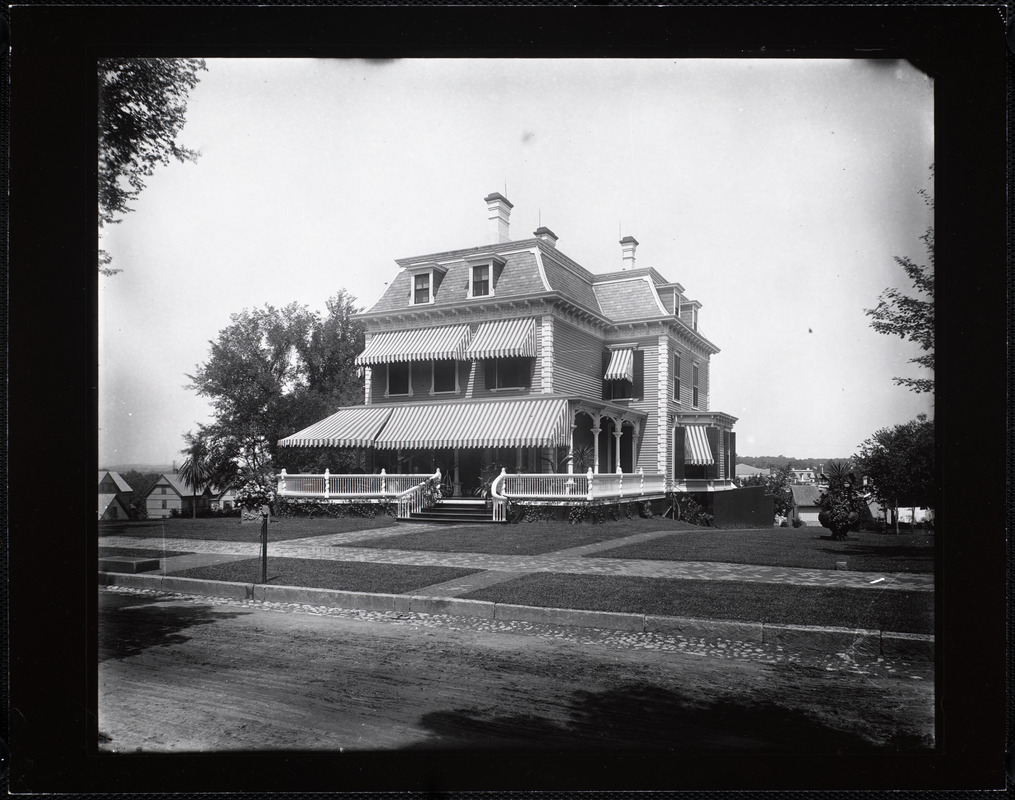 Three story house with awnings
