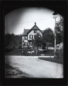 Three-story house with children and buggy