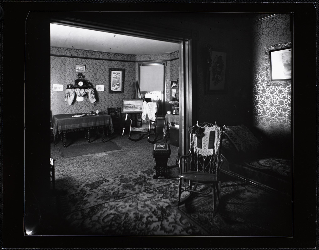 Interior rooms with rocking chair, painting, and clock