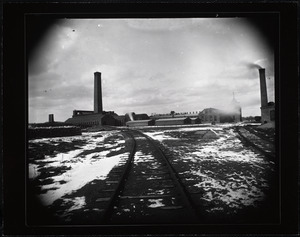 Factory buildings near railroad tracks