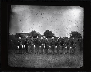Men in U.S. Army uniform in a field