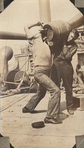 Two men with barrel of confiscated liquor aboard U.S. Revenue Cutter Comanche