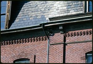 Detail of brick wall and part of roof, Burns School, Somerville, Massachusetts