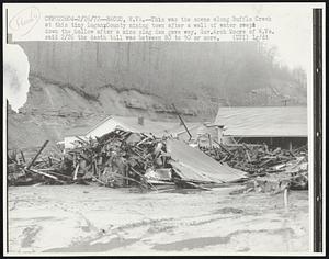 Bacco, W.VA.--This was the scene along Bufflo Creek at this tiny Logan, County mining town after a wall of water swept down the hollow after a mine slag dam gave way. Gov. Arch Moore of Q. Va. said 2/26 the death toll was between 80 to 90 or more.