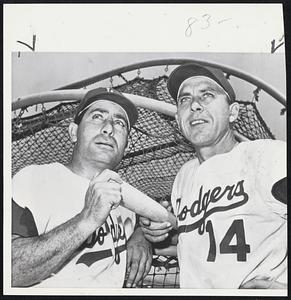 Los Angeles Old Pros who command respect in this World Series with the Chicago White Sox. They are veterans of other Dodger World Series games when in Brooklyn and they have starred this year. They are Carl Furillo (left) and Gil Hodges.