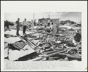 Wichita Falls, Tex. - Tornado's Wake - Residents of the southwest portion of Wichita Falls rummage through the wreckage of their home which were crushed by a tornado about 3 p.m. Friday. The twister was on the ground in a Wichita Falls residential district and in nearby Sheppard Air Force Base for about 35 minutes. Damage was estimated in millions of dollars. Seven were known dead. About 50 were believed injured as rescue and salvage operations continued.