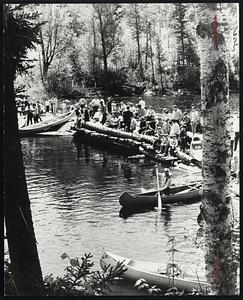 Start of upper Dead River Race at chain of ponds narrows, one of several white water races which proved "conditioner" for upcoming national championship.