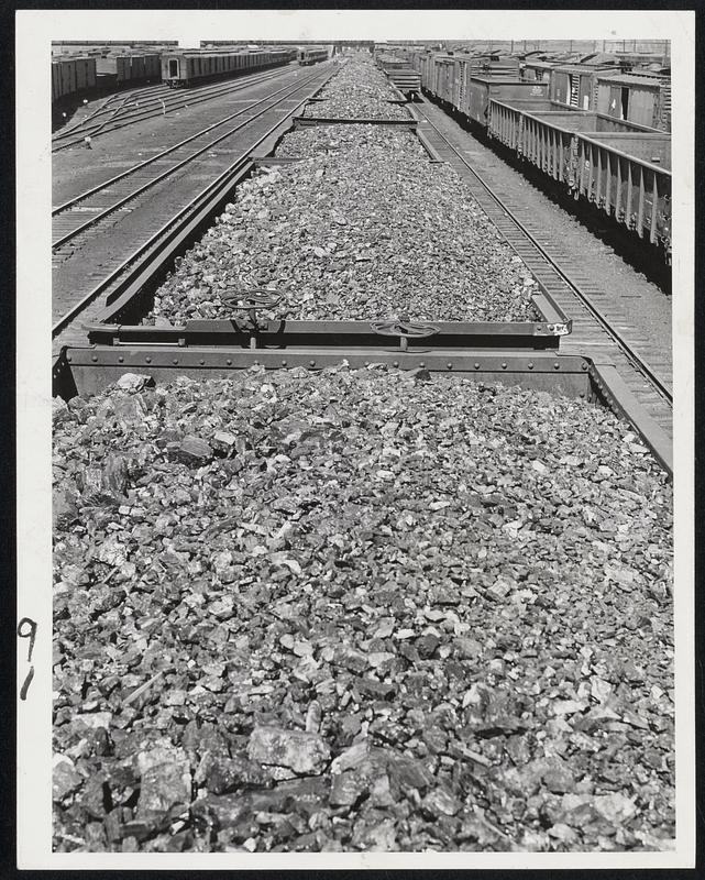 Idle Coal Cars in the East Cambridge yards of the Boston & Maine railroad reflect the gravity of the railroad strike.