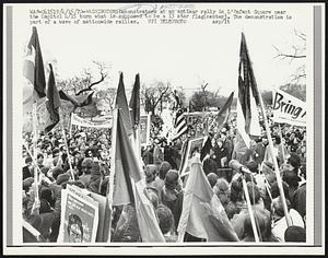 Demonstrators at an antiwar rally in L'Enfant Square near the Capitol 4/15 burn what is supposed to be a 13 star flag (center). The demonstration is part of a wave of nationwide rallies.