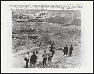 El Soldado, Chile: What was once the main street of the village of El Cobre lies devastated 3/28 after a major earthquake caused a break in a reservoir dam here. Authorities placed the toll of dead and missing at more than 350 and said delayed reports from some areas could send it higher.