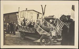 Car decorated with American flags for parade