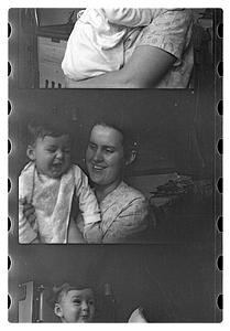 Maude Sanromá holding a child