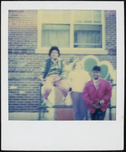 Three people posing in Newtowne Court