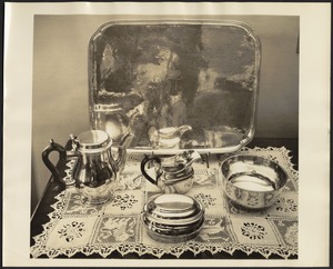 Silver coffee/tea service with tea pot, creamer, bowls, tray and lace placemat