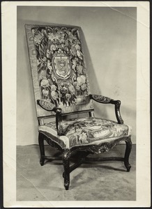 Carved wooden chair with tapestry upholstery