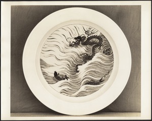 Chinese porcelain platter with "dragon issuing from waves among sporting fish"