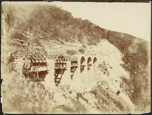 Angled view of construction of arched viaduct