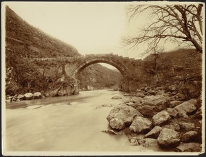 Arched keystone bridge over river