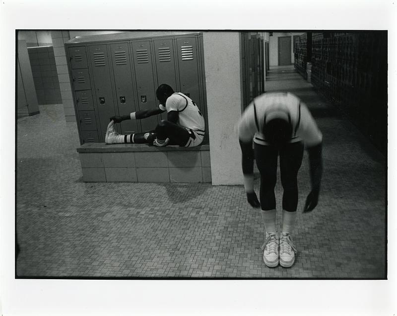 Two basketball players in the locker room