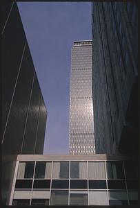 Partial view of Prudential Tower seen behind other buildings, Boston