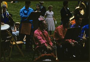 Musicians with their instruments on lawn