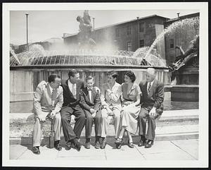 Labor Secretary in Rome. Secretary of Labor Maurice J. Tobin (second from left) sits on a wall of the famous Esedra Fountain, also known as the fountain of The Naiads, with a group of friends in Rome of June 24. Left to right are: Col. Peter C. Borre of Boston; Tobin; Maurice Tobin, Jr.; Mrs. Peter C. Borre; and the Hon. Joseph M. McDonough of Boston. Tobin was recently received by the pope in private audience.