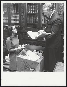 Kevin White with the help of his secretary Mrs. Deidre Snyder cleans out his office at State House