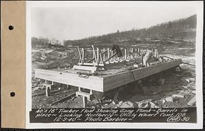 Contract No. 108, Utility Wharves, Quabbin Reservoir, Ware, 40 ft. by 16 ft. timber float showing gang plank, barrels in place, looking northerly, Ware, Mass., Dec. 9, 1940