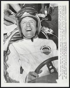 Indianapolis- Colorful Eddie Sachs of Detroit, Mich., grins for the cameras here 5/17 after he qualified for the 500-mile Race at an average speed of 151.439mph. Sachs chalked up the fastest qualifying run of the day here 5/17. A total of 21 cars are now qualified to fill the 33-car field of the annual Memorial Day 500-Mile race