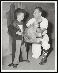 Mayor's Field Day. Fenway Park. Little Richard Doyle 6 yrs of Newton gets a hoot out of trying on Al Schacht's evening apparel. Richard is nephew to Mike Kelleher Fire Commissioner