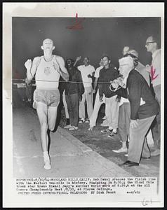 Bob Schul crosses the finish line with the fastest two-mile in history. Finishing in 8:26.4 the Miami Ohio track star broke Michel Jazy's current world mark of 8:29.6 at the All Comers Championship Meet 8/30, at Pierce College.