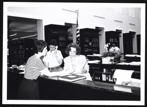 Newton Free Library, Newton, MA. PR pictures. Beth Purcell, Elinor H., at reference desk