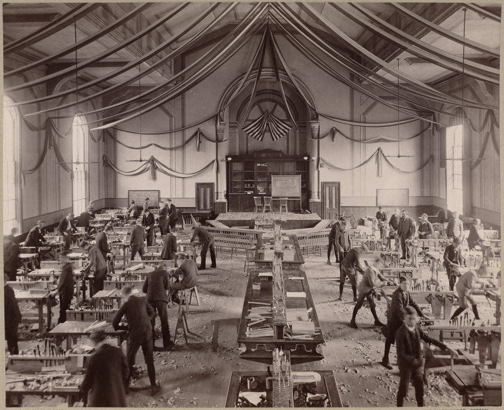 Wood-working room, Dahlgren Hall, with class at work.