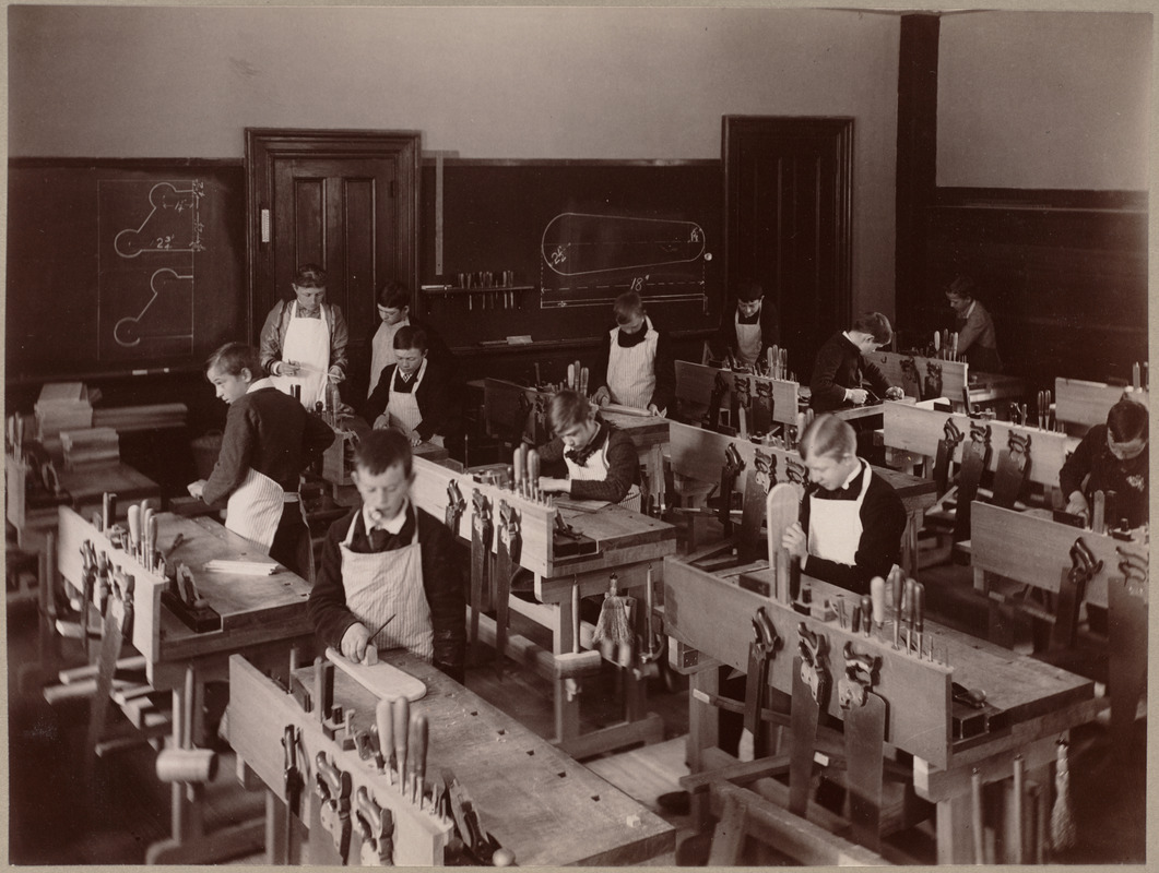 Wood-working room, with class at work. Old high school building, Kenilworth Street, Roxbury.