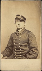 Man in military dress, sitting with hat on head