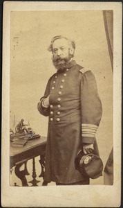 Man in military dress standing with hand in coat