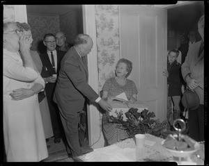 Woman receiving gift at party