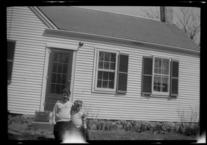 Two unidentified young boys in front of house, n.d.