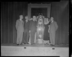 Unidentified group with grandfather clock