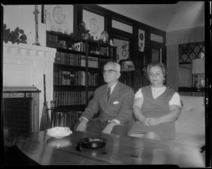 Unidentified couple seated on couch