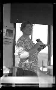 Unidentified woman with binoculars