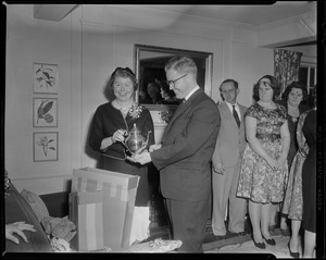 Unidentified couple opening gifts at a celebration